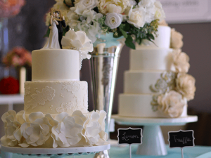 Wedding Cakes on Display with a metal vase